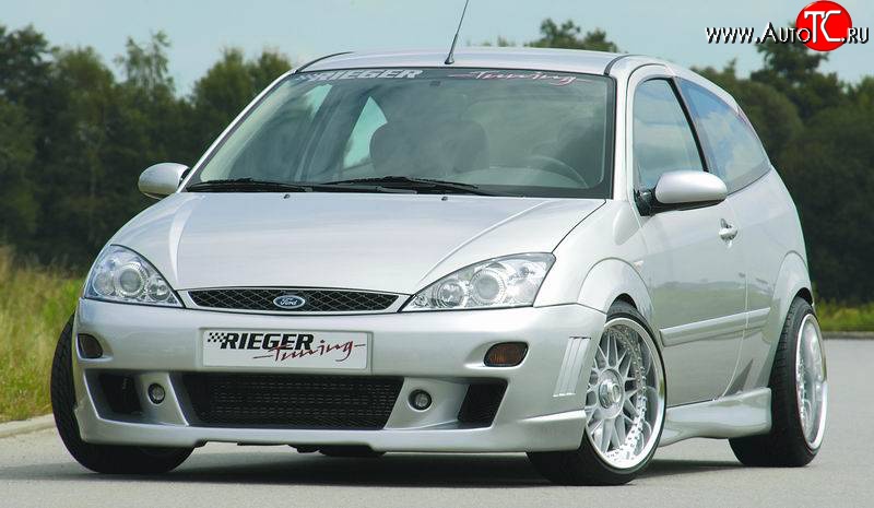 8 899 р. Передний бампер Rieger  Ford Focus  1 (1998-2005) седан дорестайлинг, универсал дорестайлинг, хэтчбэк 3 дв. дорестайлинг, хэтчбэк 5 дв. дорестайлинг, седан рестайлинг, универсал рестайлинг, хэтчбэк 3 дв. рестайлинг, хэтчбэк 5 дв. рестайлинг  с доставкой в г. Кемерово