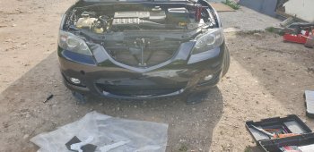 6 849 р. Передний бампер TYG (без отверстий под омыватели, 1.6L/2.0L) Mazda 3/Axela BK дорестайлинг седан (2003-2006) (Неокрашенный)  с доставкой в г. Кемерово. Увеличить фотографию 2