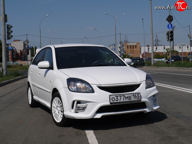 10 999 р. Передний бампер Vita Dm  KIA Rio ( 2 JB,  4 FB) (2005-2025) дорестайлинг седан, дорестайлинг, хэтчбэк 5 дв., рестайлинг, хэтчбэк 5 дв., рестайлинг седан (Без сетки, Неокрашенный)  с доставкой в г. Кемерово