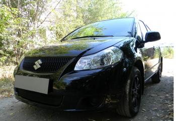 2 899 р. Защита радиатора Стрелка11 Стандарт Suzuki SX4 GYC21S дорестайлинг седан (2006-2012) (черная)  с доставкой в г. Кемерово. Увеличить фотографию 2